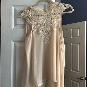 Lacy light sleeves top with beautiful front detailing and a tie back.